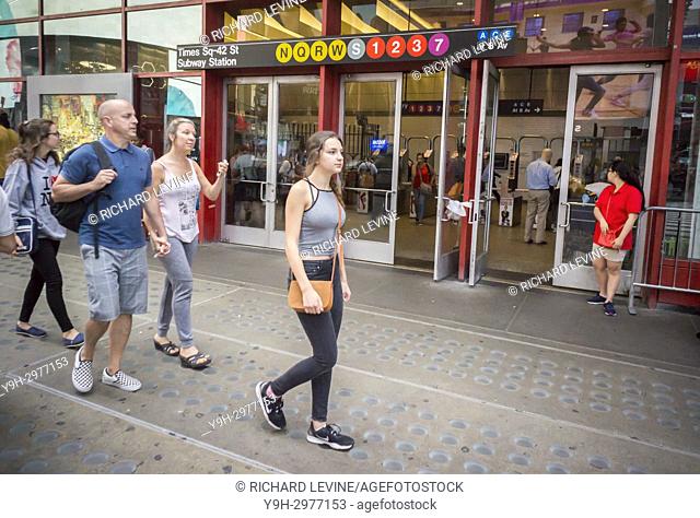 Commuters and passer-by at the Times Square subway station in New York on Thursday, July 27, 2017. NYS Governor Andrew Cuomo has called on the private sector to...