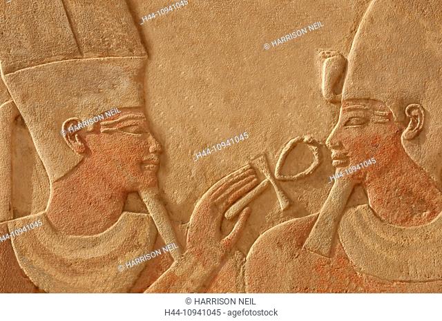 Magnificent bas relief of the god amun makes the gift of life (ankh) to the pharaoh Thutmoses IV. Sculpted in red quartzite