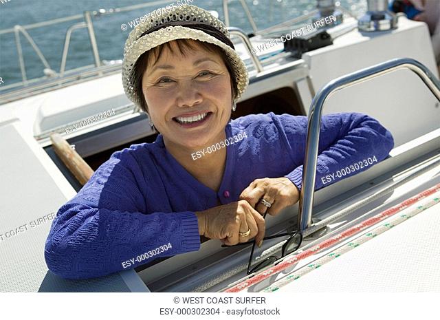 Woman on sailboat smiling portrait