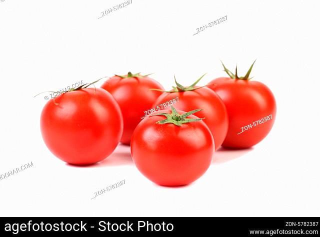 Five red ripe tomatoes isolated on white background