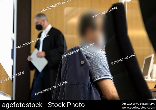 20 May 2022, North Rhine-Westphalia, Gütersloh: The defendant is sitting in the courtroom of the Gütersloh Regional Court