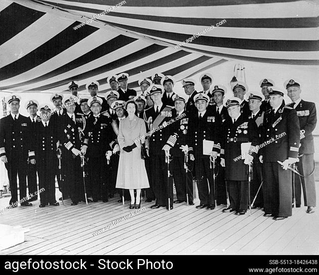 The Queen Receives Naval Officers Aboard The Royal Yacht -- H.M. The Queen and H. R. H. the Duke of Edinburgh with foreign Naval Officers aboard H.M.S