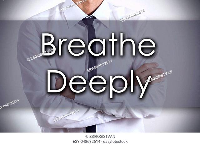 Breathe Deeply - Closeup of a young businessman with text - business concept - horizontal image