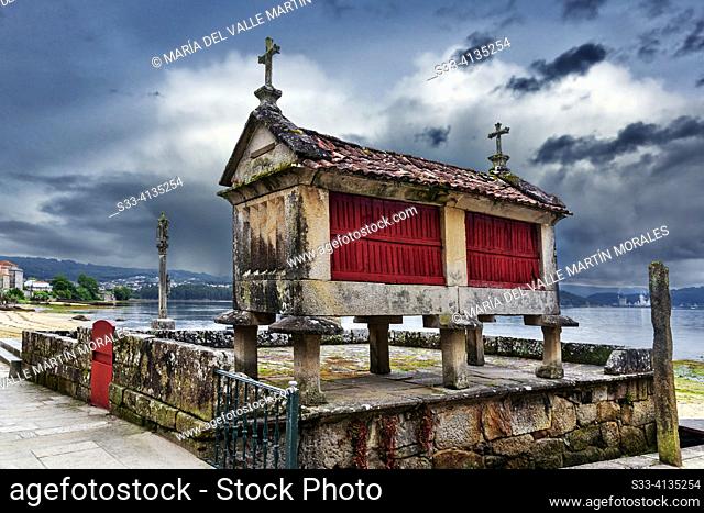 Granary in Combarro. Pontevedra. Galicia A hórreo is a traditional Galician construction used to store grain and crops. The Combarro hórreo is built with a...