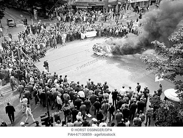 Burning car in Duesseldorf during a student demonstration on 12 June 1968. Students had brought an old, not functional car to burn
