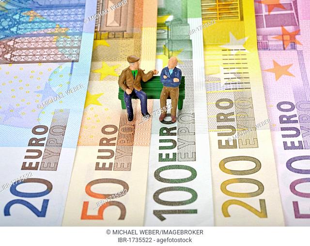 Various Euro banknotes, senior citizens sitting on a park bench, symbolic image for retirement provisions, old age pension