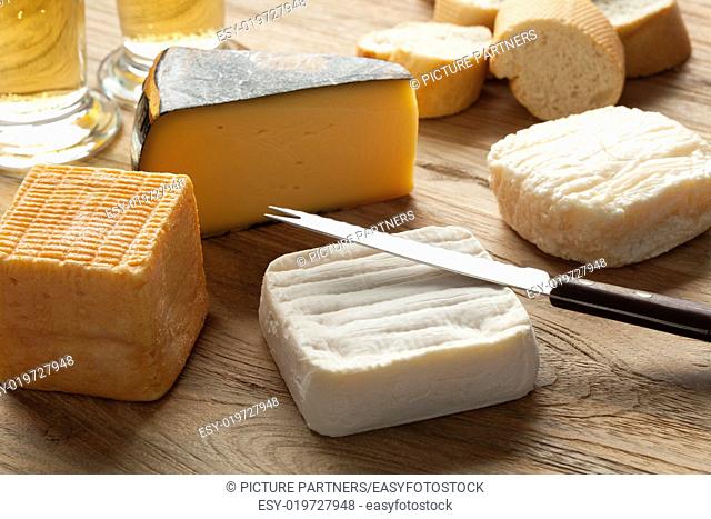 Traditional Belgian cheese board as dessert with beer and bread