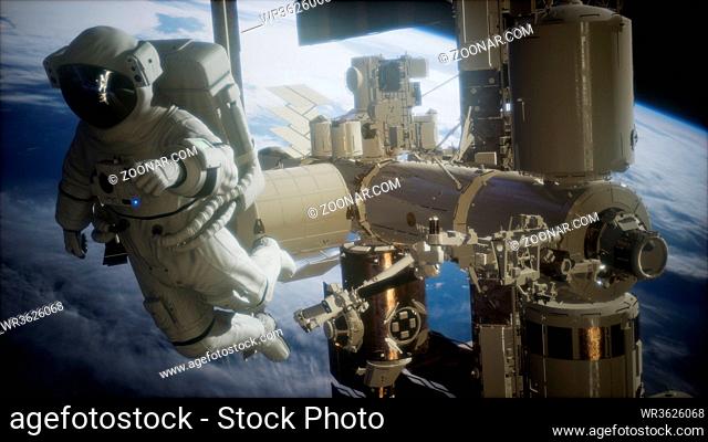 International Space Station and astronaut in outer space over the planet Earth. Elements of this image furnished by NASA