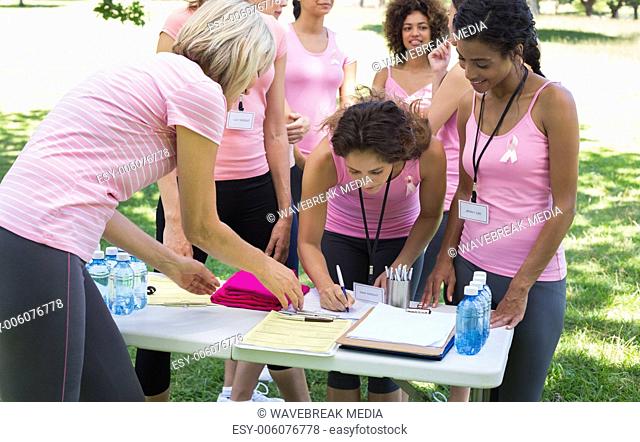 Participants registering for breast cancer campaign