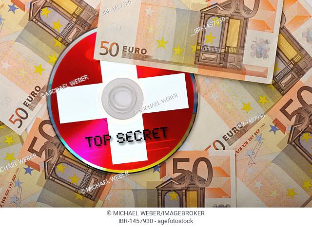 DVD, CD, euro bills, symbolic image for the purchase of bank records, tax evasion, data protection, banking secrecy, tax dodgers, tax cheats