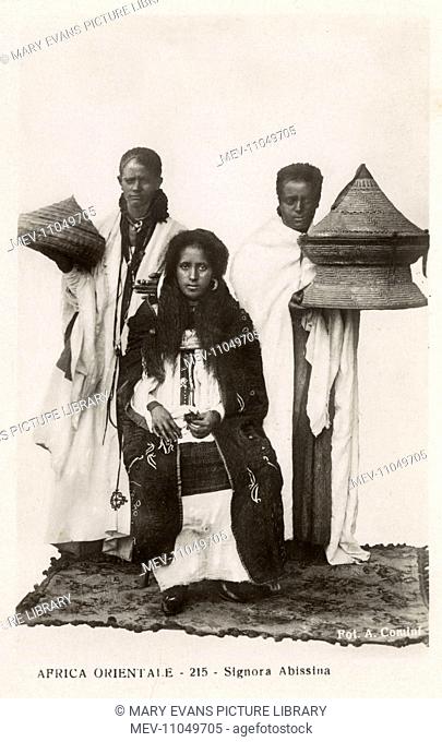 Ethiopian Noblewoman with two attendants carrying possessions in two ornate baskets with conical lids