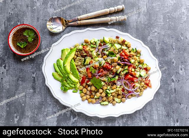 Quinoa salad with chickpeas, avocado, cucumber and tomatoes
