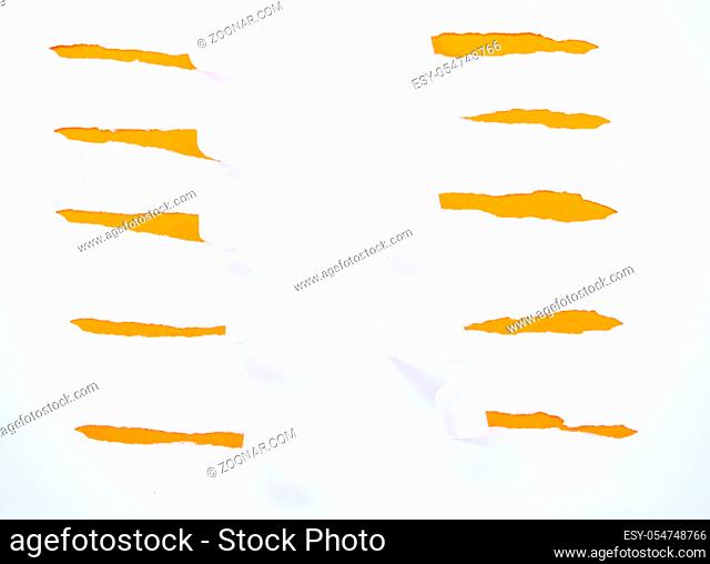 Torn white paper isolated on orange