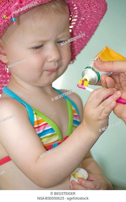 little child brushing teeth