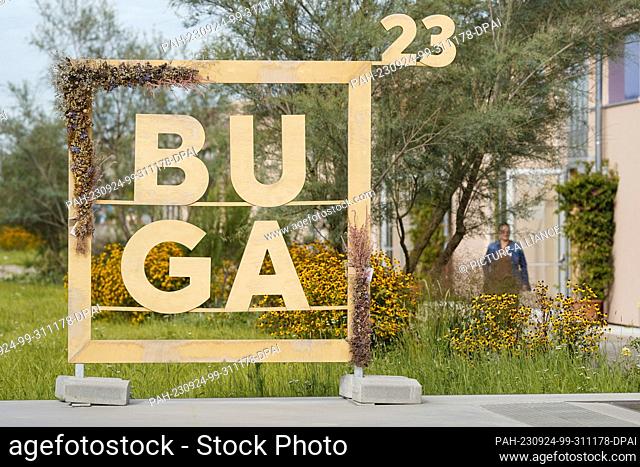 PRODUCTION - 20 September 2023, Baden-Württemberg, Mannheim: A wooden construction with the lettering ""BUGA 23"" stands on the grounds of the Federal...