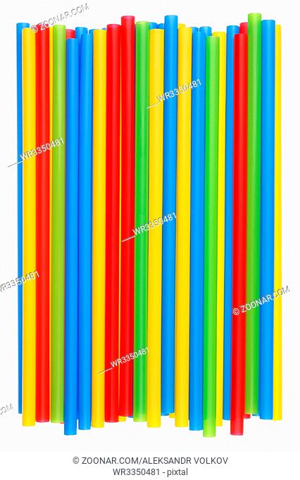 Heap of plastic multi-colored straws for cocktail with a diameter of eight millimeters. Isolated studio shot