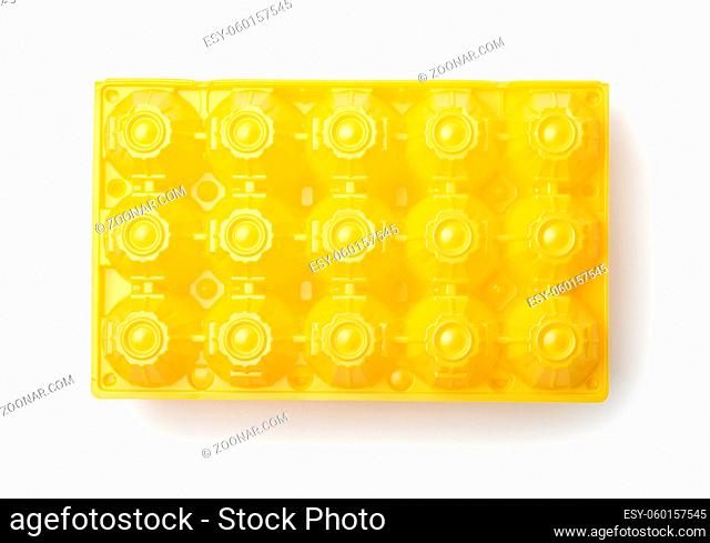 Top view of yellow plastic eggs box isolated on white