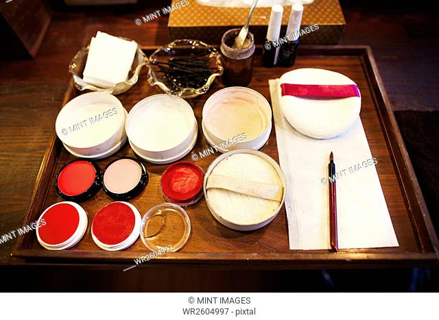 A tray of pots, rice powders, blushers and loose powder used in the white face make up of geisha women