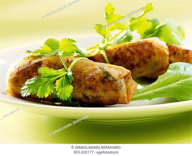 Deep-fried filo pastry rolls filled with tuna & soft cheese