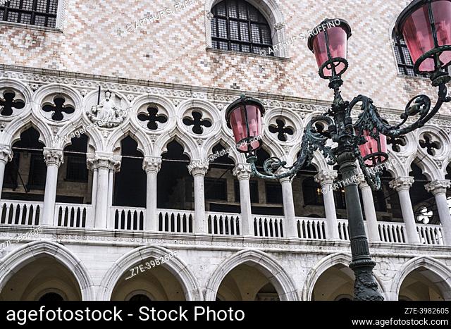 Lamp post and exterior of Ducal Palace (Palazzo Ducale), St. Mark's Square (Piazza San Marco). Venice, Veneto Region, Italy