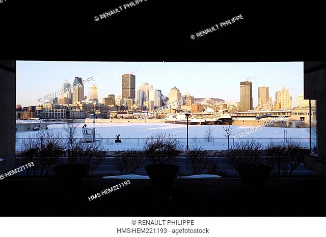Canada, Quebec Province, Montreal, Vieux Montreal Old Montreal District, the frozen Vieux Port old harbour and Downtown skyscrapers from Habitat 67 by architect...