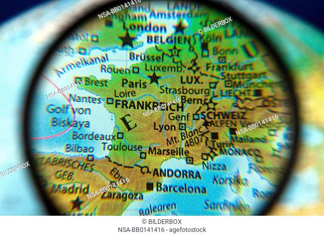 France on a globe with the magnifying glass