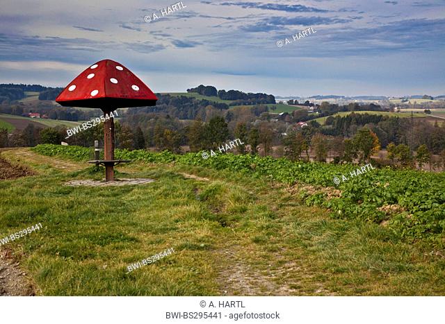 shelter for hikers modelled on a fly agaric on a ridge of hills between fields, Germany, Bavaria, Isental, Dorfen