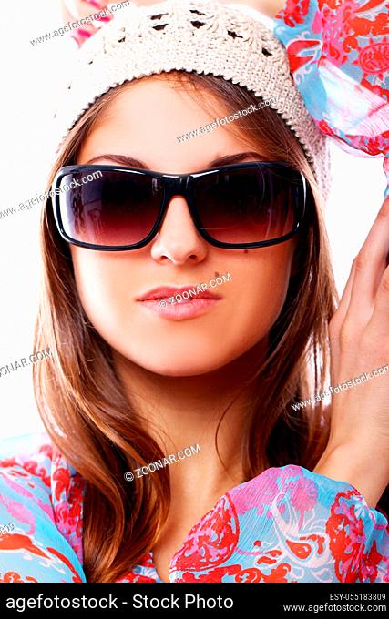 Stylish woman in sunglasses over white background