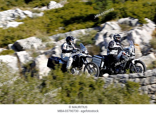 2 motorcycles, single cylinder Enduros, Yamaha Tenere and BMW G 650 GS, moving, Southern France, Mediterranean Sea, year of construction in 2012