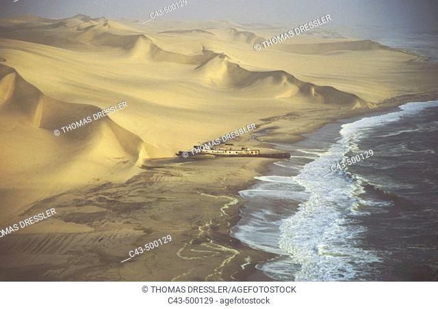 Aerial view of the Shaunee wreck, stranded in 1976 south of Walvis Bay, between Namib Desert and Atlantic Ocean. Namib-Naukluft Park, Namibia