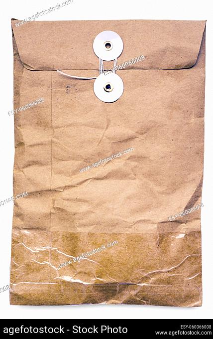 vintage paper parcel with thread lock isolated on white