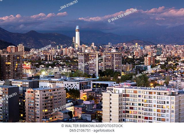 Chile, Santiago, elevated city view towards the Gran Torre Santiago, dusk