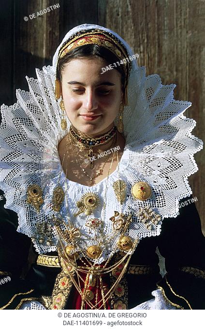 Young woman wearing the traditional costume with embroidery and gold filigree jewels, Quartucciu, Sardinia, Italy