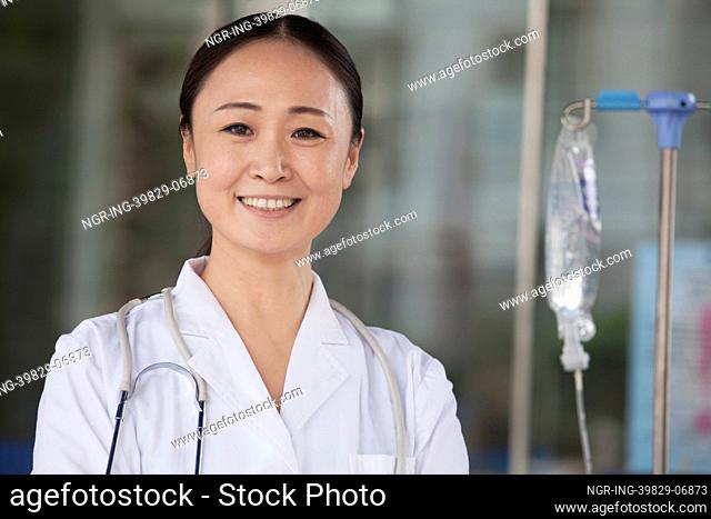 Portrait of smiling female doctor outside of the hospital