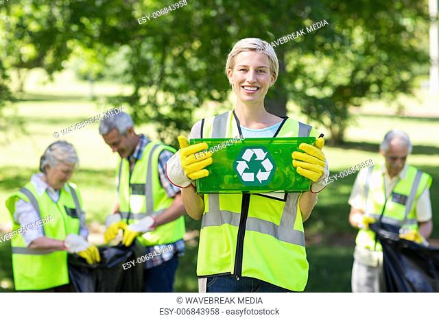 Happy mother holding recycling case