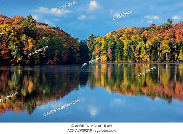 Fall colour on Horseshoe Lake in Muskoka near Rosseau, Ontario, Canada