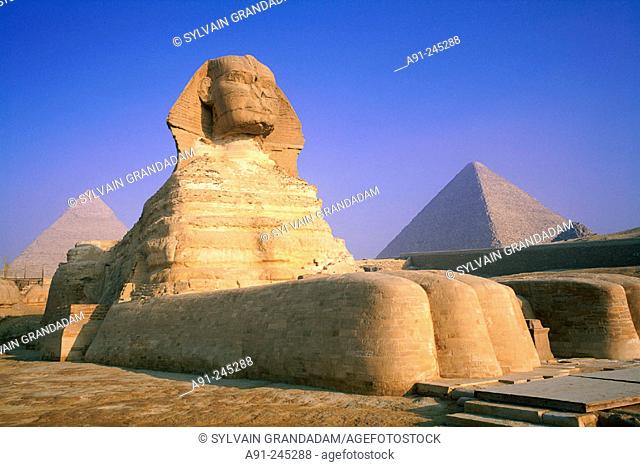 The Sphinx and pyramids at the back. Gizeh. Egypt
