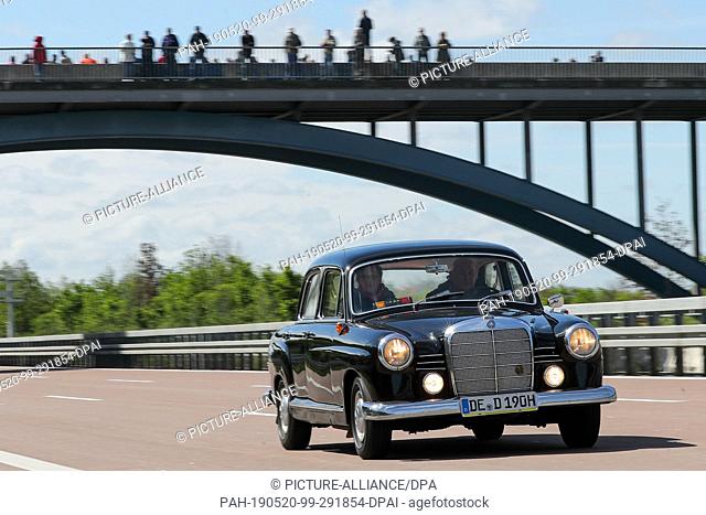 12 May 2019, Saxony-Anhalt, Dessau-Roßlau: A historic Mercedes-Benz Ponton 190 from the 1960s travels on the A9 motorway near Dessau
