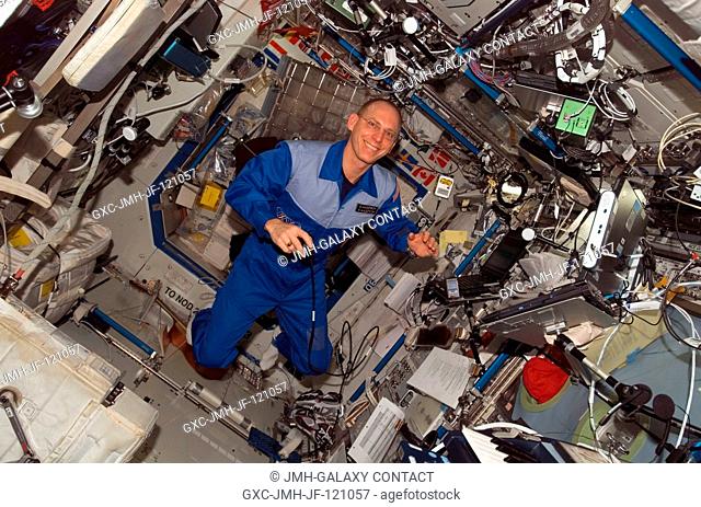 Astronaut Clay Anderson, Expedition 15 flight engineer, smiles for a photo while floating in the Destiny laboratory of the International Space Station