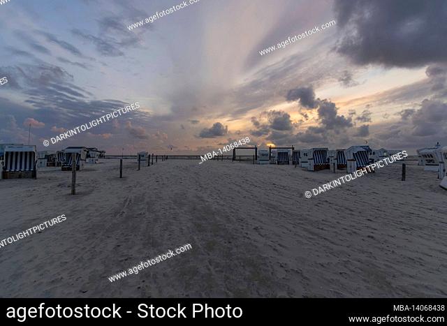 on the beach of sankt peter ording in sunset, germany