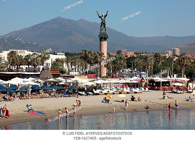 Tourists enjoy the beach in Puerto Banus, Marbella, Andalusia, Spain, Europe