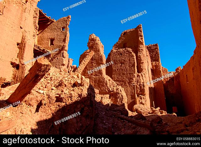 Abandoned mud brick kasbah ruins in the desert Tinghir Morocco