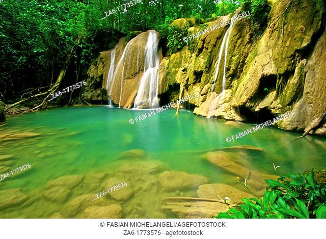 Waterfall and idyllic emerald pond in TurueÌpano National Park, Eastern Venezuela