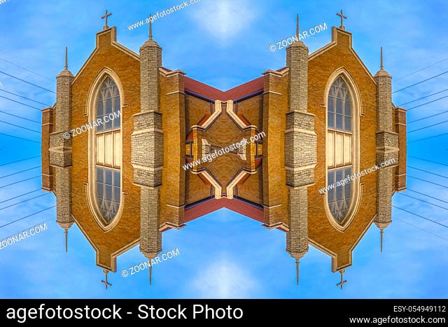 Quad reflection of Church on a blue sky background. Geometric kaleidoscope pattern on mirrored axis of symmetry reflection
