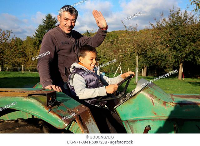 Boy driving a tractor
