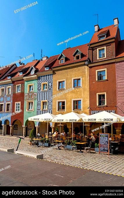 Poznan, Poland - September 8, 2021: view of the colorful Renaissance architecture buildings on the old market square of Poznan with outdoor restaurants