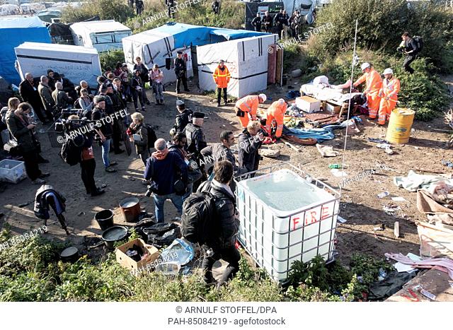 Demolition of the first huts commences while police forces secure the area from all sides in Calais, France, 25 October 2016