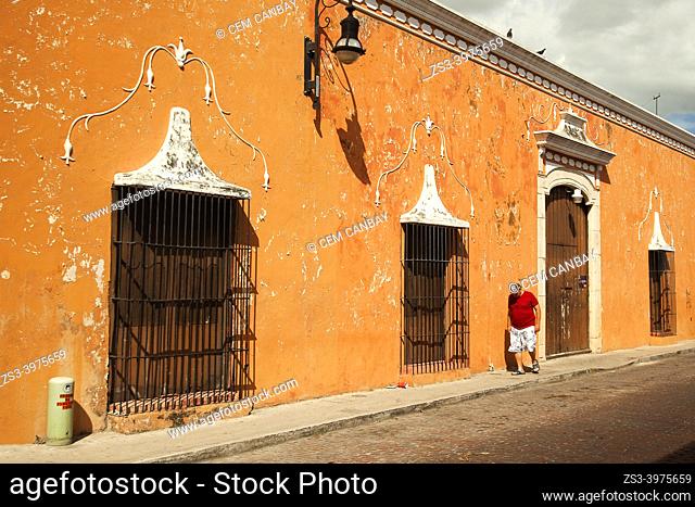 Man in front of the colonial buildings at the historic center, Merida, Riviera Maya, Yucatan State, Mexico, Central America