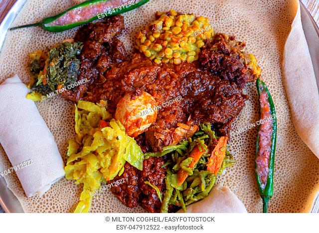 Injera served with Chicken and egg Doro Wat, berbere, vegetables and lentils. Injera, the national dish of Ethiopia, is a sourdough flatbread made from teff...