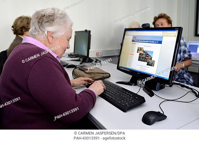 Senior citizen Ruth Fleck (81) works on a desktop computer at the internet cafe for senior citizens at the adult education centre in Vechta, Germany